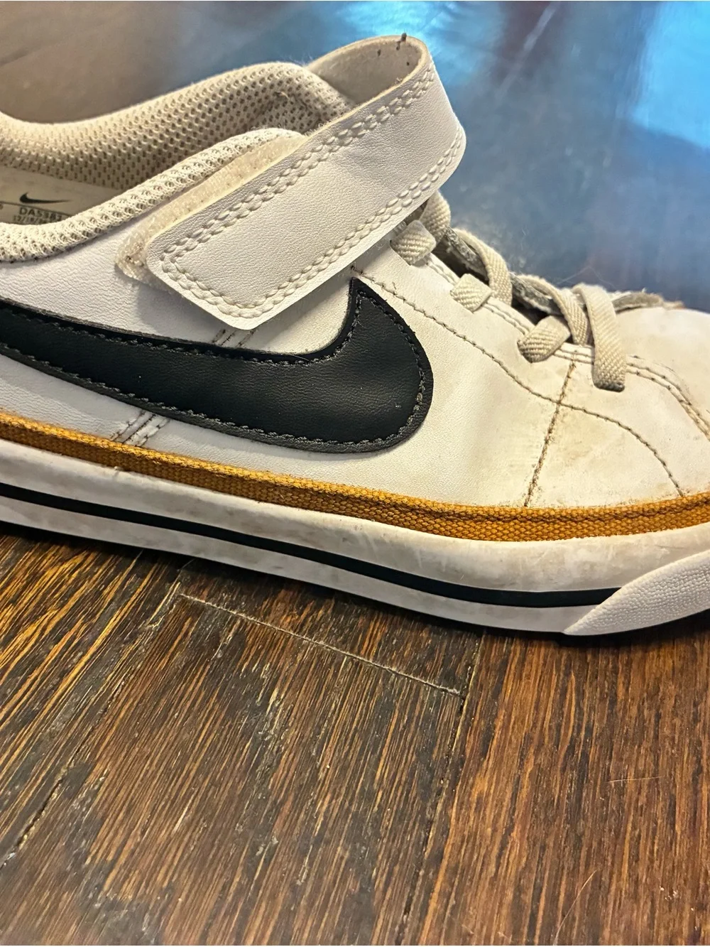 Nike Kids White Sneakers with Black Swoosh and Tan Trim